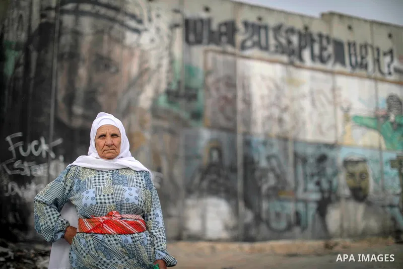 Palestinians make their way through Qalandia checkpoint to attend the second Friday prayer of the holy fasting month of Ramadan in Jerusalem's Al-Aqsa mosque, near Ramallah in the occupied West Bank, on May 25, 2018. Ram...