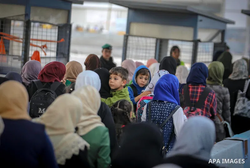 Palestinians make their way through Qalandia checkpoint to attend the second Friday prayer of the holy fasting month of Ramadan in Jerusalem's Al-Aqsa mosque, near Ramallah in the occupied West Bank, on May 25, 2018. Ram...