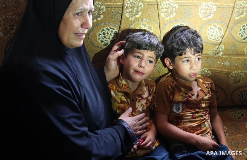 Relatives of Palestinian Ahmed Qutoosh, 23, who died of his wounds endured during clashes with Israeli troops in a tent city protest where Palestinians demand the right to return to their homeland at the Israel-Gaza bord...