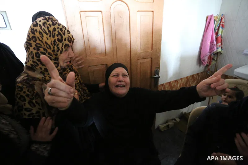 Relatives of Palestinian Ahmed Qutoosh, 23, who died of his wounds endured during clashes with Israeli troops in a tent city protest where Palestinians demand the right to return to their homeland at the Israel-Gaza bord...