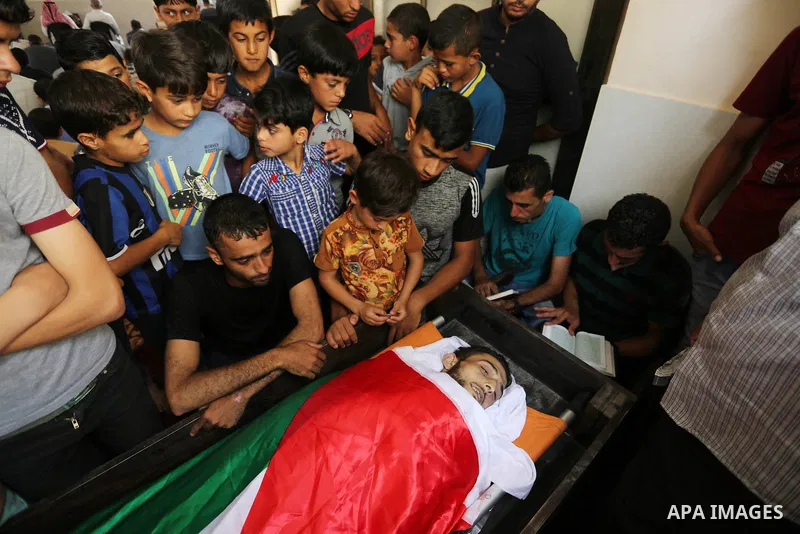 Relatives of Palestinian Ahmed Qutoosh, 23, who died of his wounds endured during clashes with Israeli troops in a tent city protest where Palestinians demand the right to return to their homeland at the Israel-Gaza bord...