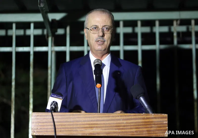 Palestinian Prime Minister, Rami Hamdallah, attends a charity breakfast to the families of martyrs and prisoners, in the West Bank city of Tulkarem on May 25, 2018. Photo by Prime Minister Office