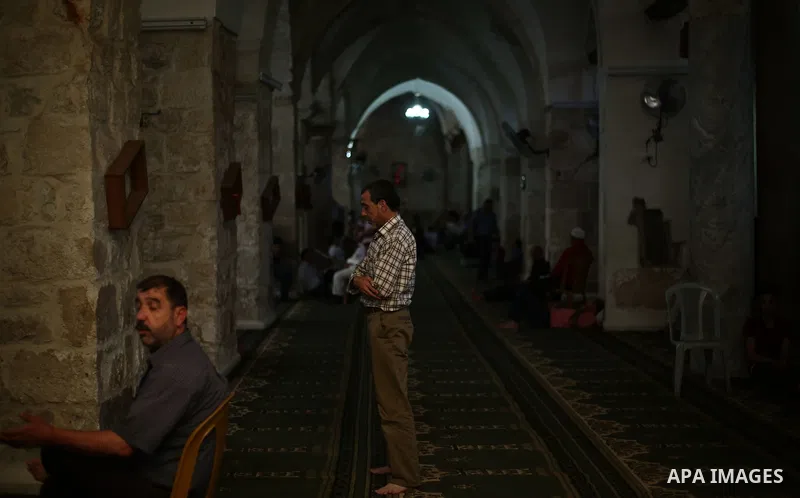 Palestinians read the Koran, Islam's holiest book, at a mosque in Gaza City on the Muslim holy month of Ramadan in the West Bank city of Nablus on May 26, 2018. Ramadan is sacred to Muslims because it is during that mont...