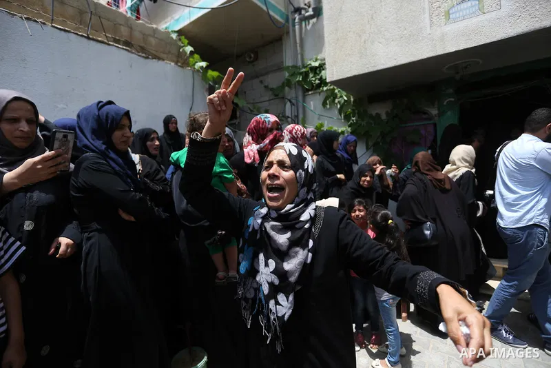 Palestinian women mourn during the funeral of Palestinian Islamic Jihad militant Abdel Halim al-Naqa, 28, who was killed in Israeli tank fire earlier in the day, in Khan Younis in the southern Gaza strip on May 27, 2018....