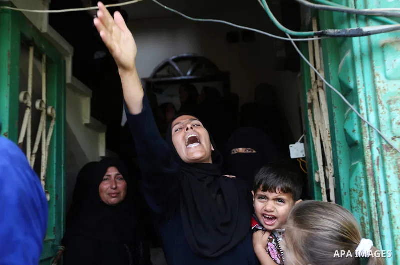 Palestinian women mourn during the funeral of Palestinian Islamic Jihad militant Abdel Halim al-Naqa, 28, who was killed in Israeli tank fire earlier in the day, in Khan Younis in the southern Gaza strip on May 27, 2018....
