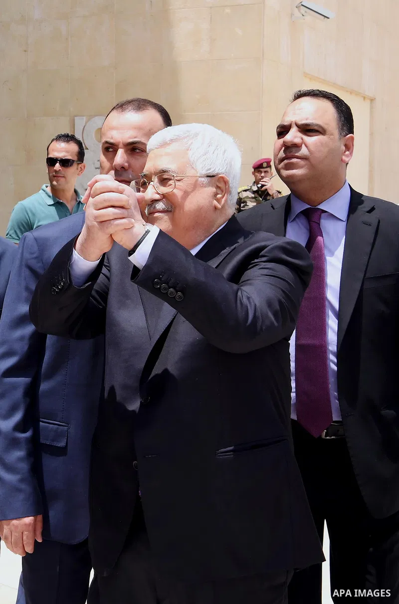 Palestinian President Mahmoud Abbas leaves a hospital in the West Bank city of Ramallah on May 28, 2018 following eight days of treatment for pneumonia. Photo by Thaer Ganaim