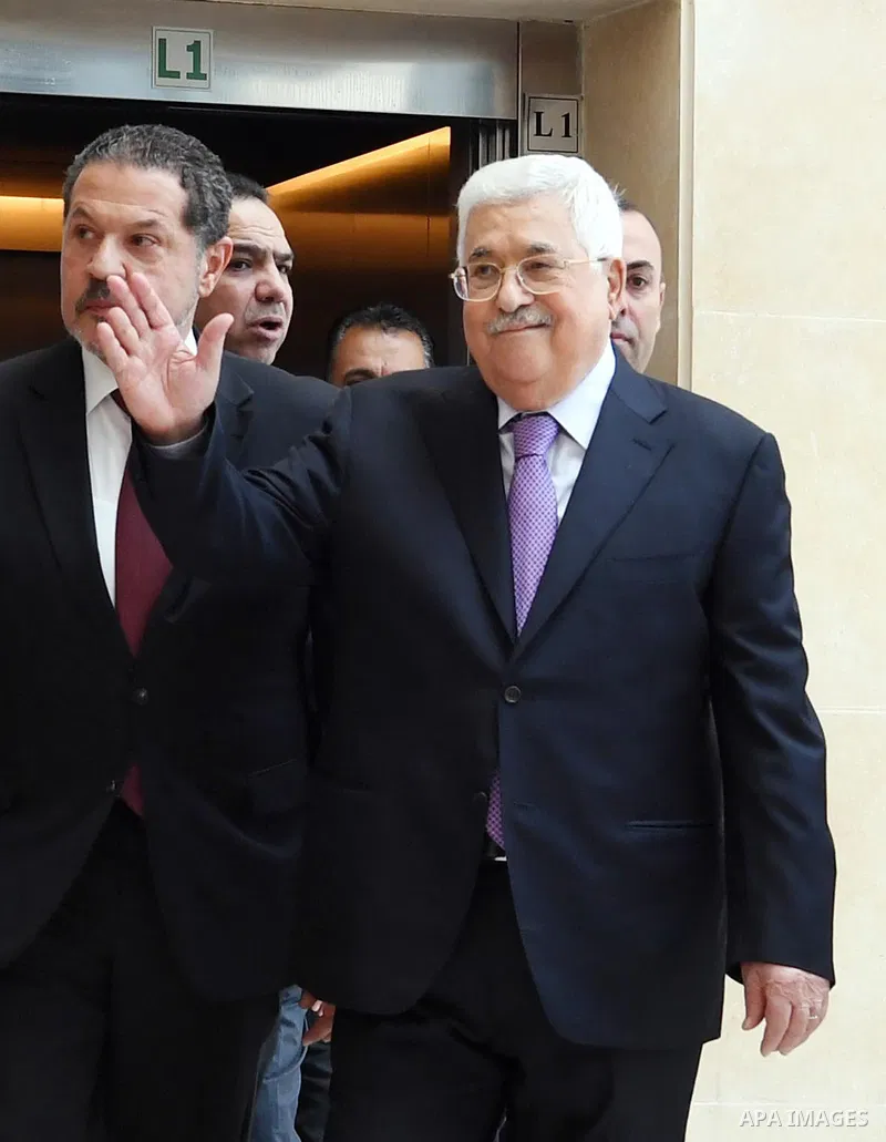 Palestinian President Mahmoud Abbas leaves a hospital in the West Bank city of Ramallah on May 28, 2018 following eight days of treatment for pneumonia. Photo by Thaer Ganaim