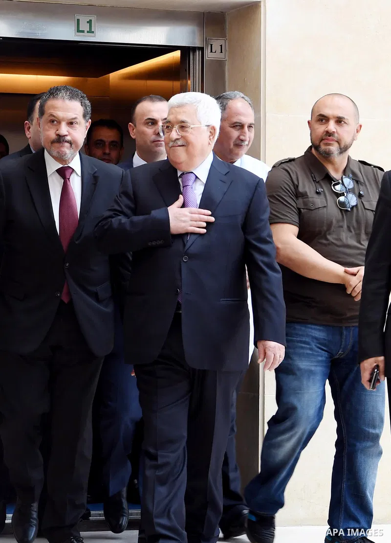 Palestinian President Mahmoud Abbas leaves a hospital in the West Bank city of Ramallah on May 28, 2018 following eight days of treatment for pneumonia. Photo by Thaer Ganaim