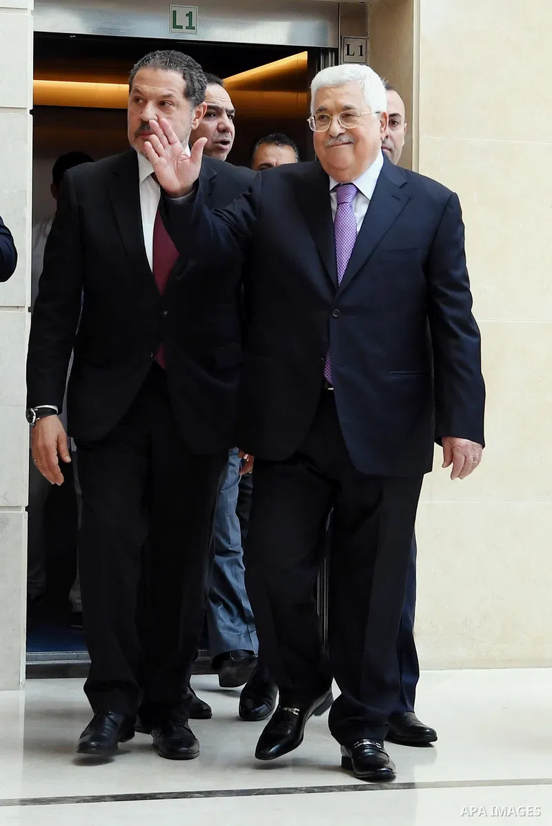 Palestinian President Mahmoud Abbas leaves a hospital in the West Bank city of Ramallah on May 28, 2018 following eight days of treatment for pneumonia. Photo by Thaer Ganaim