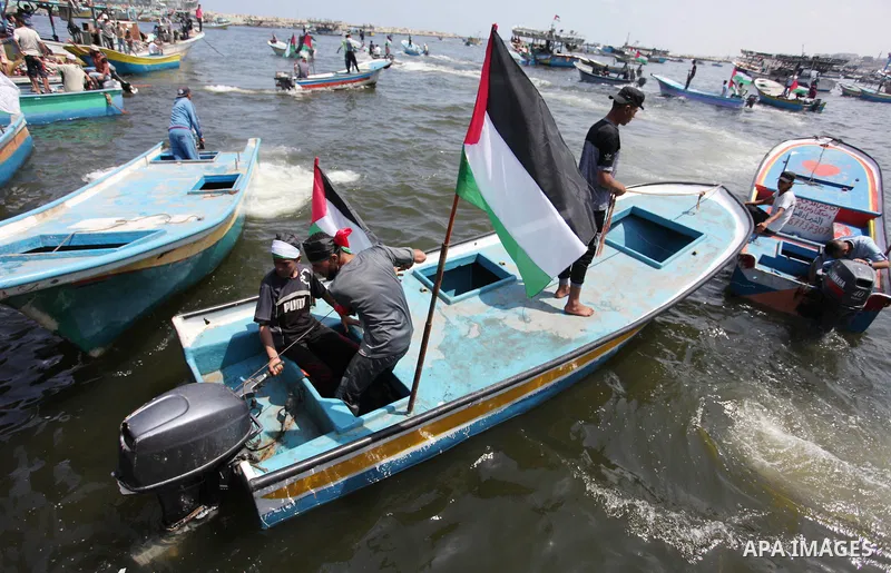 Palestinian activists ride fishing boats as they protesting and perhaps trying to breach Israel's naval blockade on Gaza, setting to sail from Gaza City harbour towards Europe on May 29, 2018. Palestinians in Gaza are pl...