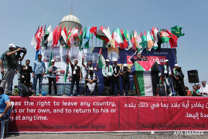 Palestinian activists prepare themselves to ride fishing boats as they protesting and perhaps trying to breach Israel's naval blockade on Gaza, setting to sail from Gaza City harbour towards Europe on May 29, 2018. Pales...