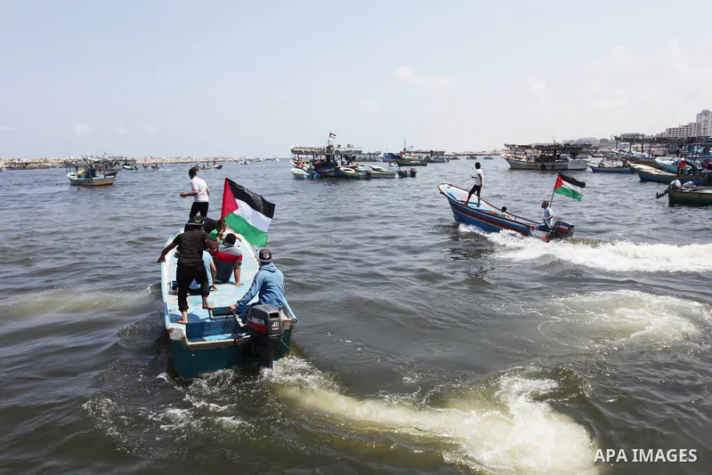 Palestinian activists ride fishing boats as they protesting and perhaps trying to breach Israel's naval blockade on Gaza, setting to sail from Gaza City harbour towards Europe on May 29, 2018. Palestinians in Gaza are pl...