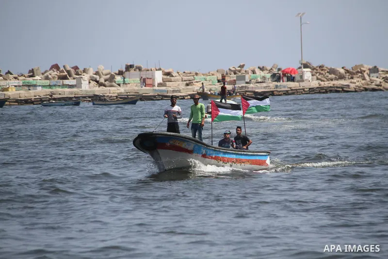 Palestinian activists ride fishing boats as they protesting and perhaps trying to breach Israel's naval blockade on Gaza, setting to sail from Gaza City harbour towards Europe on May 29, 2018. Palestinians in Gaza are pl...