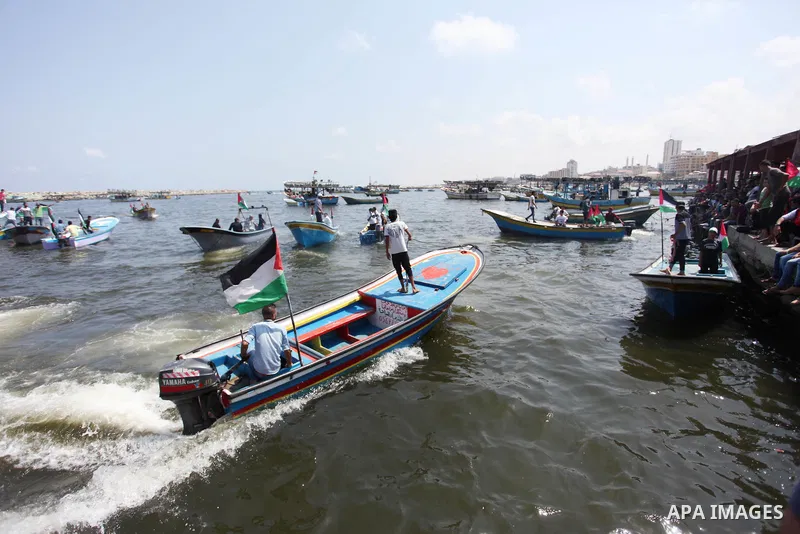 Palestinian activists ride fishing boats as they protesting and perhaps trying to breach Israel's naval blockade on Gaza, setting to sail from Gaza City harbour towards Europe on May 29, 2018. Palestinians in Gaza are pl...