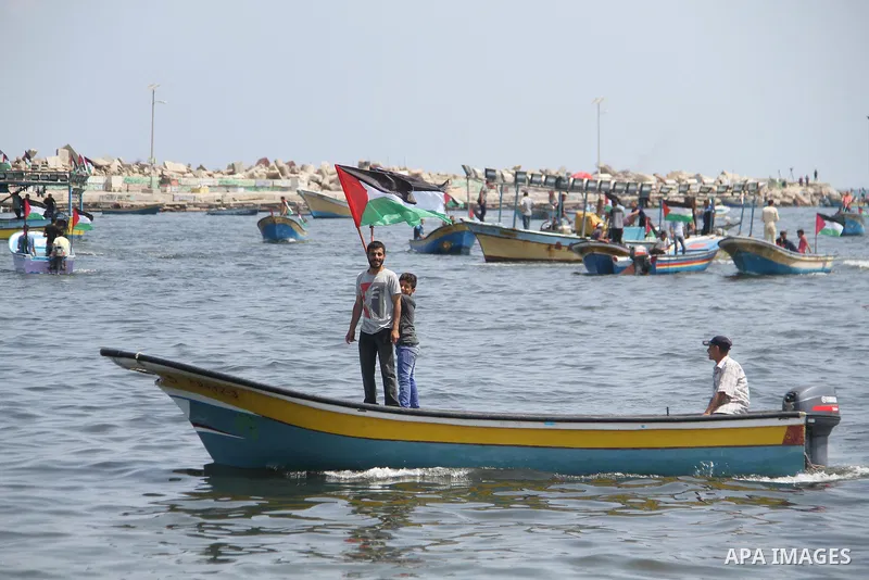 Palestinian activists ride fishing boats as they protesting and perhaps trying to breach Israel's naval blockade on Gaza, setting to sail from Gaza City harbour towards Europe on May 29, 2018. Palestinians in Gaza are pl...