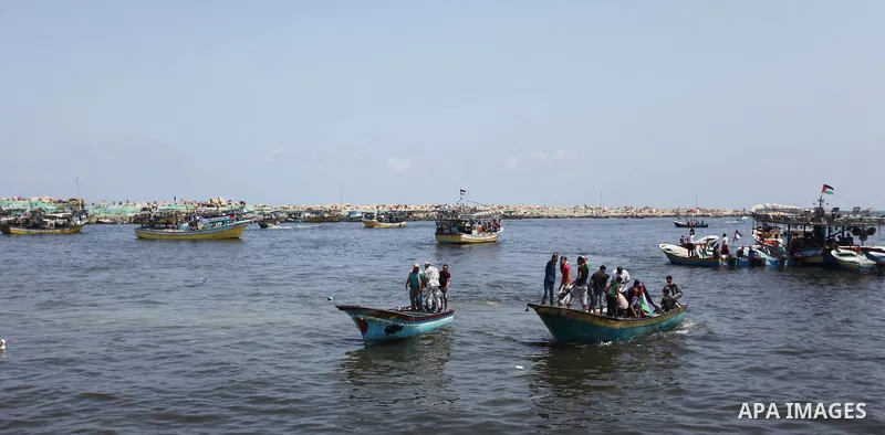 Palestinian activists ride fishing boats as they protesting and perhaps trying to breach Israel's naval blockade on Gaza, setting to sail from Gaza City harbour towards Europe on May 29, 2018. Palestinians in Gaza are pl...