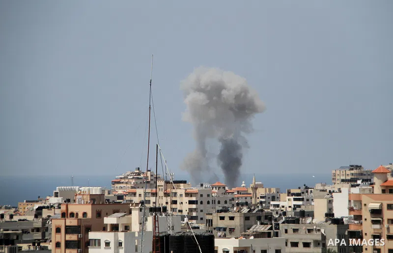 A picture taken from Gaza City on May 29, 2018, shows a smoke billowing in the background following an Israeli air strike on the Palestinian enclave. The Israeli military launched a series of air strikes on Palestinian p...
