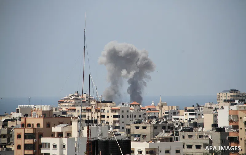 A picture taken from Gaza City on May 29, 2018, shows a smoke billowing in the background following an Israeli air strike on the Palestinian enclave. The Israeli military launched a series of air strikes on Palestinian p...