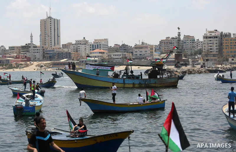 Palestinian activists ride fishing boats as they protesting and perhaps trying to breach Israel's naval blockade on Gaza, setting to sail from Gaza City harbour towards Europe on May 29, 2018. Palestinians in Gaza are pl...