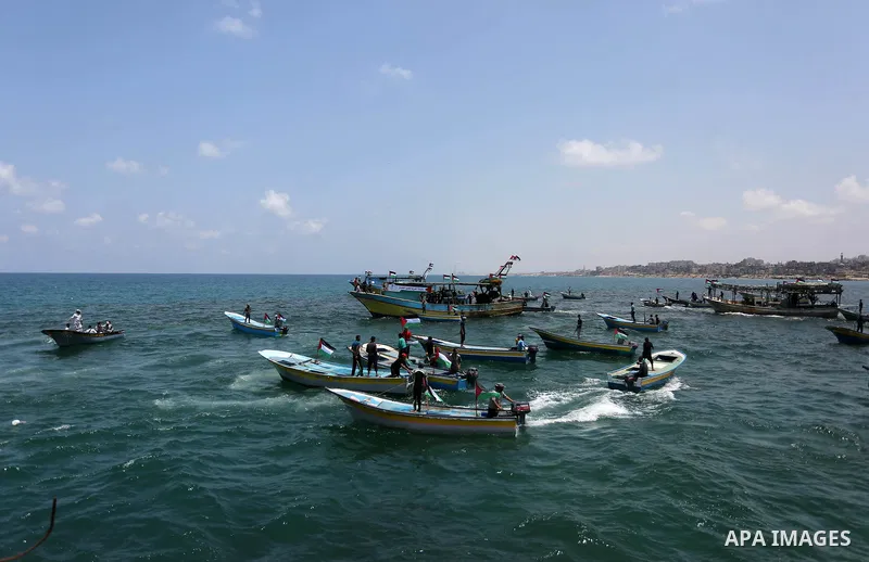 Palestinian activists ride fishing boats as they protesting and perhaps trying to breach Israel's naval blockade on Gaza, setting to sail from Gaza City harbour towards Europe on May 29, 2018. Palestinians in Gaza are pl...