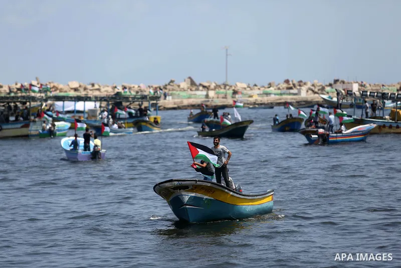 Palestinian activists ride fishing boats as they protesting and perhaps trying to breach Israel's naval blockade on Gaza, setting to sail from Gaza City harbour towards Europe on May 29, 2018. Palestinians in Gaza are pl...