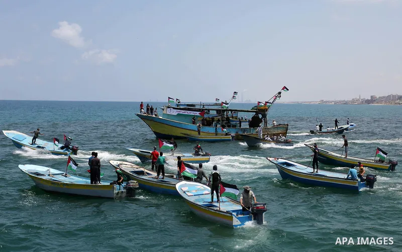 Palestinian activists ride fishing boats as they protesting and perhaps trying to breach Israel's naval blockade on Gaza, setting to sail from Gaza City harbour towards Europe on May 29, 2018. Palestinians in Gaza are pl...