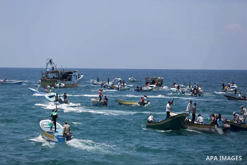 Palestinian activists ride fishing boats as they protesting and perhaps trying to breach Israel's naval blockade on Gaza, setting to sail from Gaza City harbour towards Europe on May 29, 2018. Palestinians in Gaza are pl...
