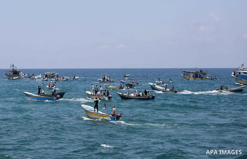 Palestinian activists ride fishing boats as they protesting and perhaps trying to breach Israel's naval blockade on Gaza, setting to sail from Gaza City harbour towards Europe on May 29, 2018. Palestinians in Gaza are pl...