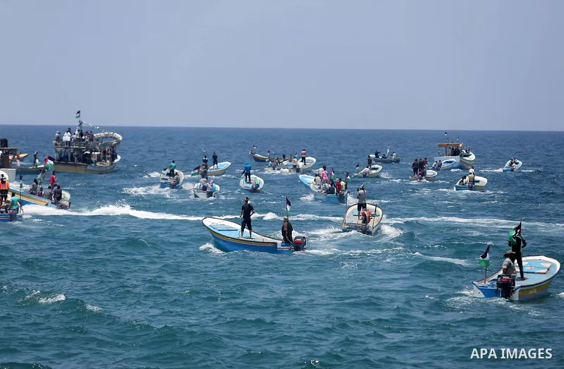Palestinian activists ride fishing boats as they protesting and perhaps trying to breach Israel's naval blockade on Gaza, setting to sail from Gaza City harbour towards Europe on May 29, 2018. Palestinians in Gaza are pl...