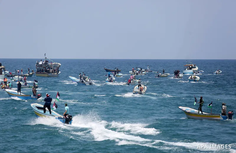 Palestinian activists ride fishing boats as they protesting and perhaps trying to breach Israel's naval blockade on Gaza, setting to sail from Gaza City harbour towards Europe on May 29, 2018. Palestinians in Gaza are pl...