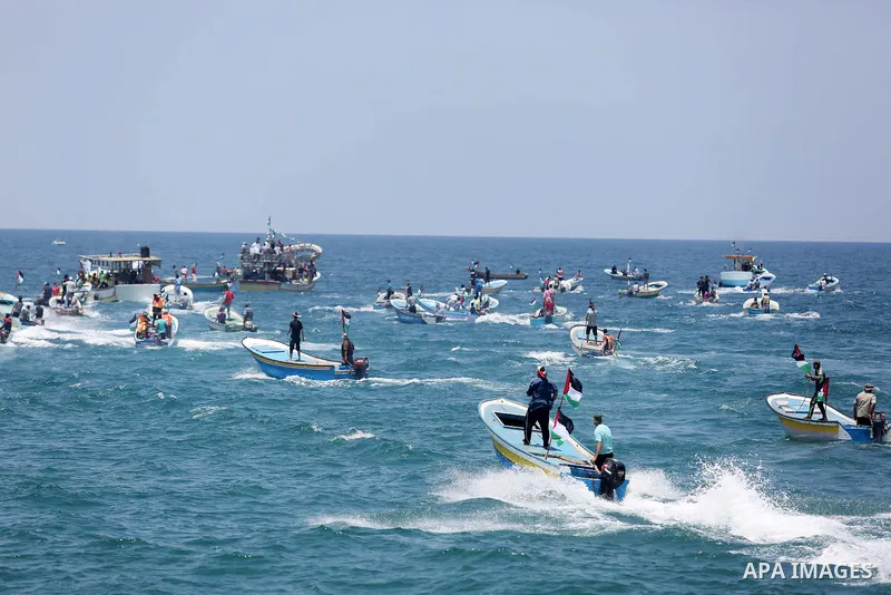 Palestinian activists ride fishing boats as they protesting and perhaps trying to breach Israel's naval blockade on Gaza, setting to sail from Gaza City harbour towards Europe on May 29, 2018. Palestinians in Gaza are pl...