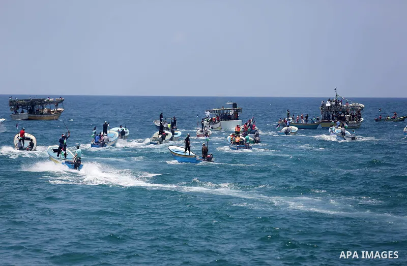 Palestinian activists ride fishing boats as they protesting and perhaps trying to breach Israel's naval blockade on Gaza, setting to sail from Gaza City harbour towards Europe on May 29, 2018. Palestinians in Gaza are pl...