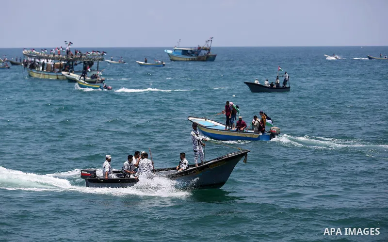 Palestinian activists ride fishing boats as they protesting and perhaps trying to breach Israel's naval blockade on Gaza, setting to sail from Gaza City harbour towards Europe on May 29, 2018. Palestinians in Gaza are pl...