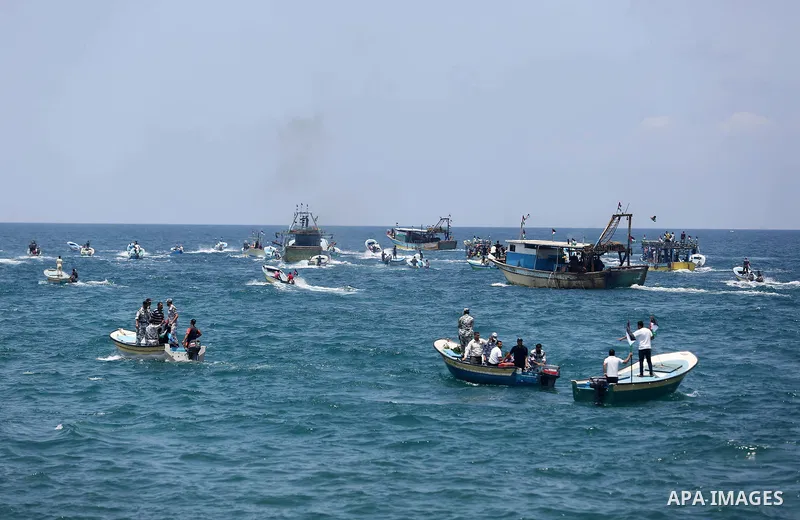 Palestinian activists ride fishing boats as they protesting and perhaps trying to breach Israel's naval blockade on Gaza, setting to sail from Gaza City harbour towards Europe on May 29, 2018. Palestinians in Gaza are pl...