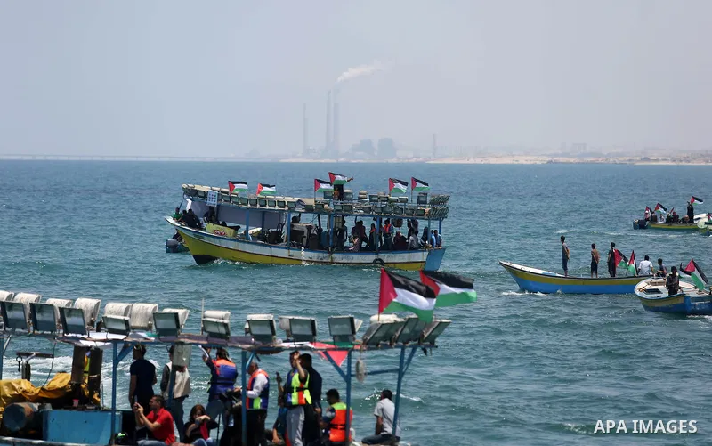 Palestinian activists ride fishing boats as they protesting and perhaps trying to breach Israel's naval blockade on Gaza, setting to sail from Gaza City harbour towards Europe on May 29, 2018. Palestinians in Gaza are pl...