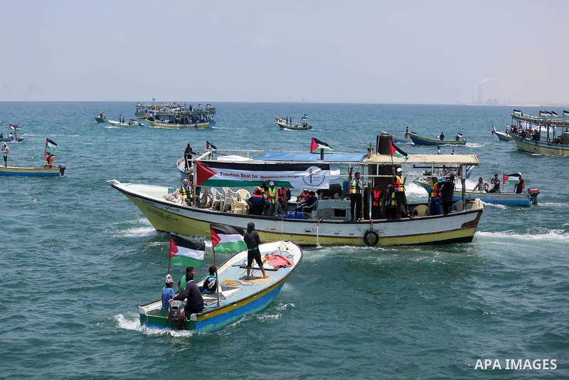 Palestinian activists ride fishing boats as they protesting and perhaps trying to breach Israel's naval blockade on Gaza, setting to sail from Gaza City harbour towards Europe on May 29, 2018. Palestinians in Gaza are pl...