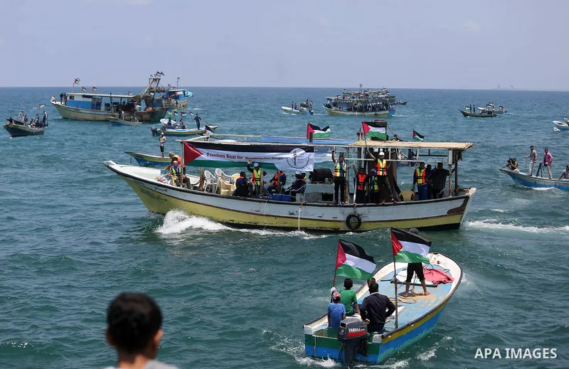 Palestinian activists ride fishing boats as they protesting and perhaps trying to breach Israel's naval blockade on Gaza, setting to sail from Gaza City harbour towards Europe on May 29, 2018. Palestinians in Gaza are pl...