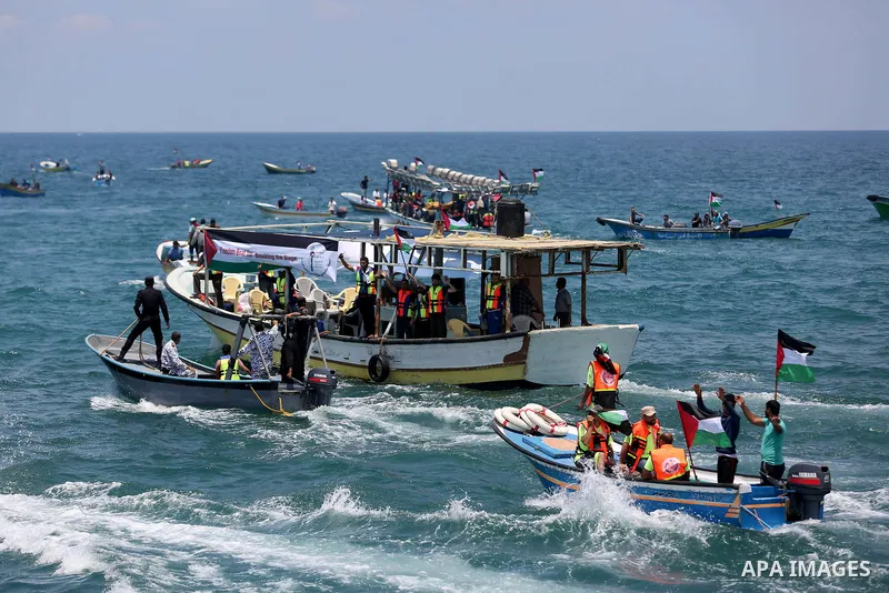 Palestinian activists ride fishing boats as they protesting and perhaps trying to breach Israel's naval blockade on Gaza, setting to sail from Gaza City harbour towards Europe on May 29, 2018. Palestinians in Gaza are pl...