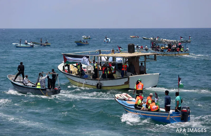 Palestinian activists ride fishing boats as they protesting and perhaps trying to breach Israel's naval blockade on Gaza, setting to sail from Gaza City harbour towards Europe on May 29, 2018. Palestinians in Gaza are pl...