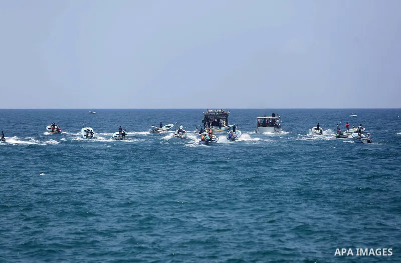 Palestinian activists ride fishing boats as they protesting and perhaps trying to breach Israel's naval blockade on Gaza, setting to sail from Gaza City harbour towards Europe on May 29, 2018. Palestinians in Gaza are pl...