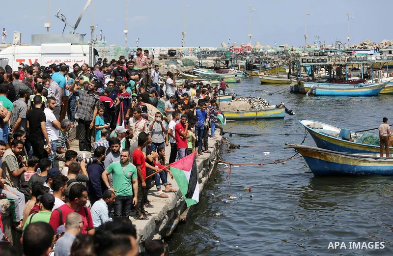 Palestinian activists ride fishing boats as they protesting and perhaps trying to breach Israel's naval blockade on Gaza, setting to sail from Gaza City harbour towards Europe on May 29, 2018. Palestinians in Gaza are pl...