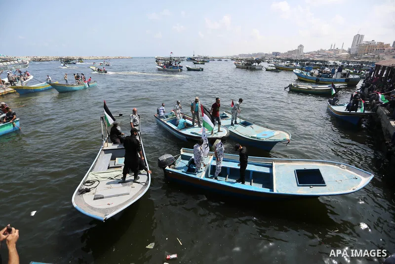 Palestinian activists ride fishing boats as they protesting and perhaps trying to breach Israel's naval blockade on Gaza, setting to sail from Gaza City harbour towards Europe on May 29, 2018. Palestinians in Gaza are pl...