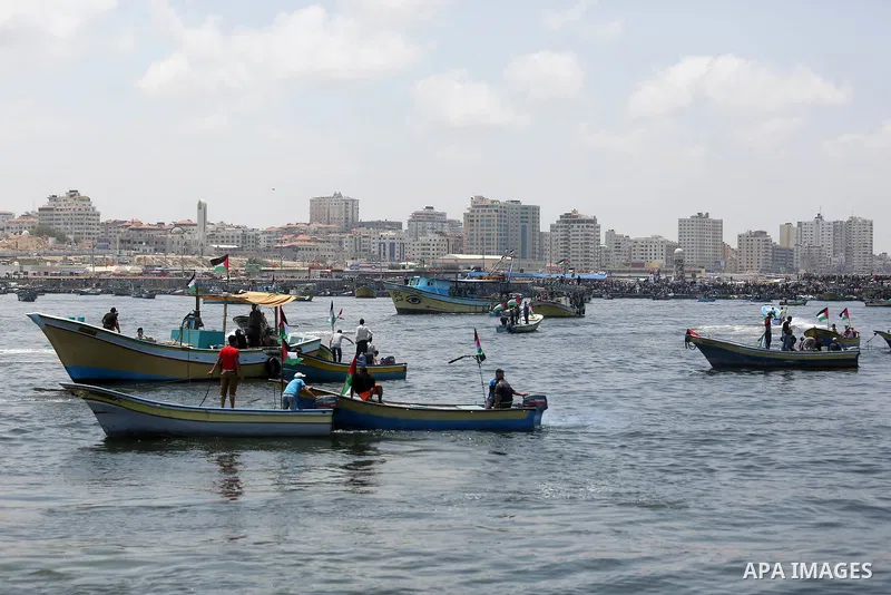 Palestinian activists ride fishing boats as they protesting and perhaps trying to breach Israel's naval blockade on Gaza, setting to sail from Gaza City harbour towards Europe on May 29, 2018. Palestinians in Gaza are pl...