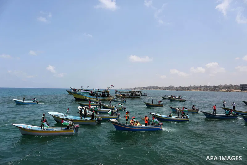 Palestinian activists ride fishing boats as they protesting and perhaps trying to breach Israel's naval blockade on Gaza, setting to sail from Gaza City harbour towards Europe on May 29, 2018. Palestinians in Gaza are pl...