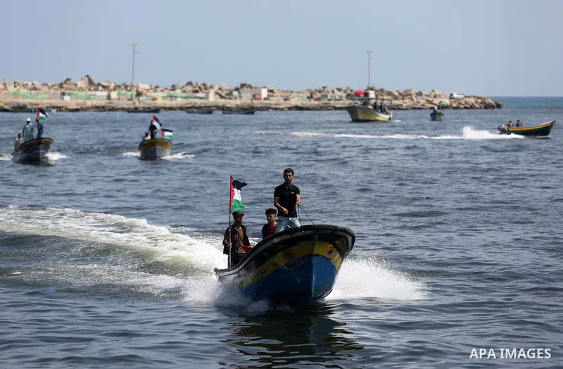 Palestinian activists ride fishing boats as they protesting and perhaps trying to breach Israel's naval blockade on Gaza, setting to sail from Gaza City harbour towards Europe on May 29, 2018. Palestinians in Gaza are pl...