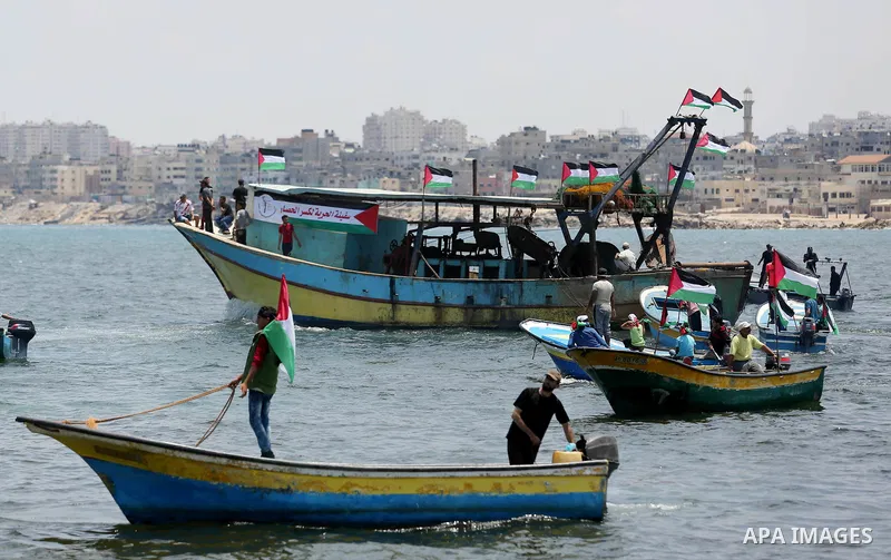 Palestinian activists ride fishing boats as they protesting and perhaps trying to breach Israel's naval blockade on Gaza, setting to sail from Gaza City harbour towards Europe on May 29, 2018. Palestinians in Gaza are pl...