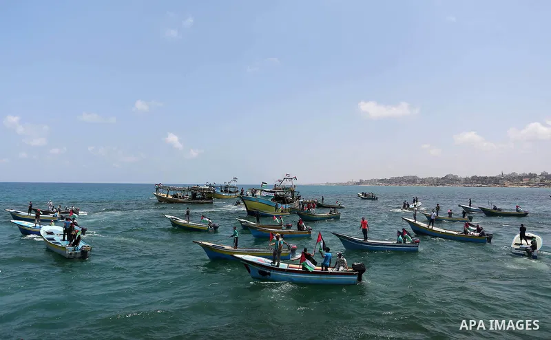 Palestinian activists ride fishing boats as they protesting and perhaps trying to breach Israel's naval blockade on Gaza, setting to sail from Gaza City harbour towards Europe on May 29, 2018. Palestinians in Gaza are pl...