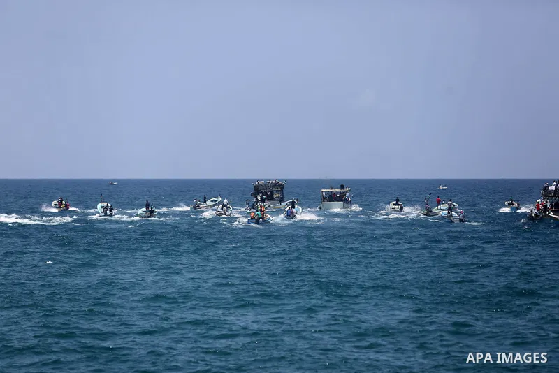 Palestinian activists ride fishing boats as they protesting and perhaps trying to breach Israel's naval blockade on Gaza, setting to sail from Gaza City harbour towards Europe on May 29, 2018. Palestinians in Gaza are pl...