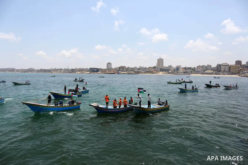 Palestinian activists ride fishing boats as they protesting and perhaps trying to breach Israel's naval blockade on Gaza, setting to sail from Gaza City harbour towards Europe on May 29, 2018. Palestinians in Gaza are pl...