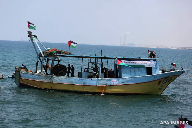 Palestinian activists ride fishing boats as they protesting and perhaps trying to breach Israel's naval blockade on Gaza, setting to sail from Gaza City harbour towards Europe on May 29, 2018. Palestinians in Gaza are pl...